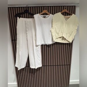 Gap white elastic-waist pants and two tops.